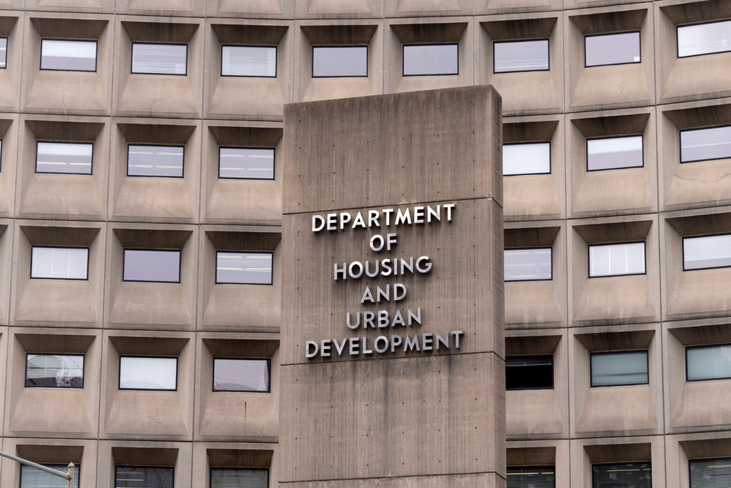 FILE - A sign for the Department of Housing and Urban Development stands outside the agency's headquarters, Jan. 16, 2026, in Washington. (AP Photo/Mark Schiefelbein, File)
