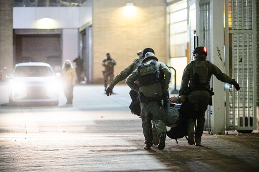 Law enforcement officers arrest a protester during a protest at a U.S. Immigration and Customs Enforcement facility in Portland, Ore. on Sunday, Oct. 5, 2025. (AP Photo/Ethan Swope) Law enforcement officers arrest a protester during a protest at a U.S. Immigration and Customs Enforcement facility in Portland, Ore. on Sunday, Oct. 5, 2025. (AP Photo/Ethan Swope)