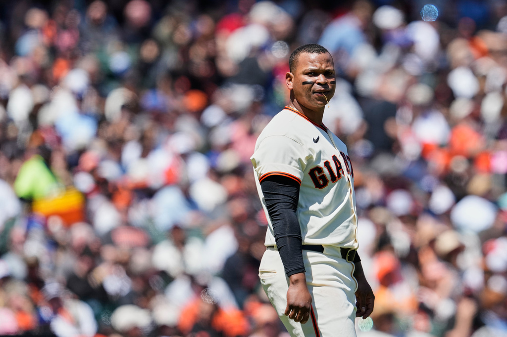 San Francisco Giants' Rafael Devers reacts after being called out on strikes during the fourth inning of a baseball game against the Los Angeles Dodgers, Thursday, April 23, 2026, in San Francisco. (AP Photo/Godofredo A. Vásquez)