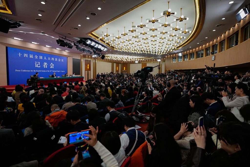 Chinese Foreign Minister Wang Yi speaks during a press conference on the sideline of the National People's Congress (NPC) at the media center, in Beijing, Sunday, March 8, 2026. (AP Photo/Andy Wong)