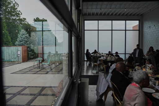 FILE - Guests sit inside during cocktail hour as empty chairs sit outside during a wedding Saturday, Aug. 23, 2025, in Newtown, Ohio. (AP Photo/Joshua A. Bickel, File) FILE - Guests sit inside during cocktail hour as empty chairs sit outside during a wedding Saturday, Aug. 23, 2025, in Newtown, Ohio. (AP Photo/Joshua A. Bickel, File)