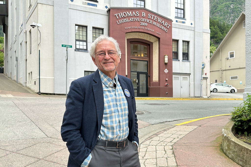 FILE - DDemocratic gubernatorial candidate Tom Begich poses for a photo in downtown Juneau, Alaska, June 17, 2026. (AP Photo/Becky Bohrer, File)