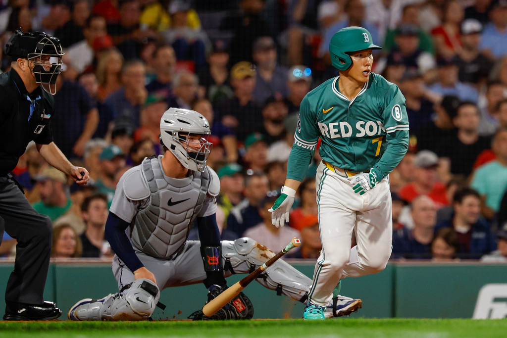 Boston Red Sox outfielder Masataka Yoshida (7) hits an RBI single in the fourth inning of a baseball game against the Detroit Tigers, Friday, Sept. 26, 2025, in Boston. (AP Photo/Greg M. Cooper)