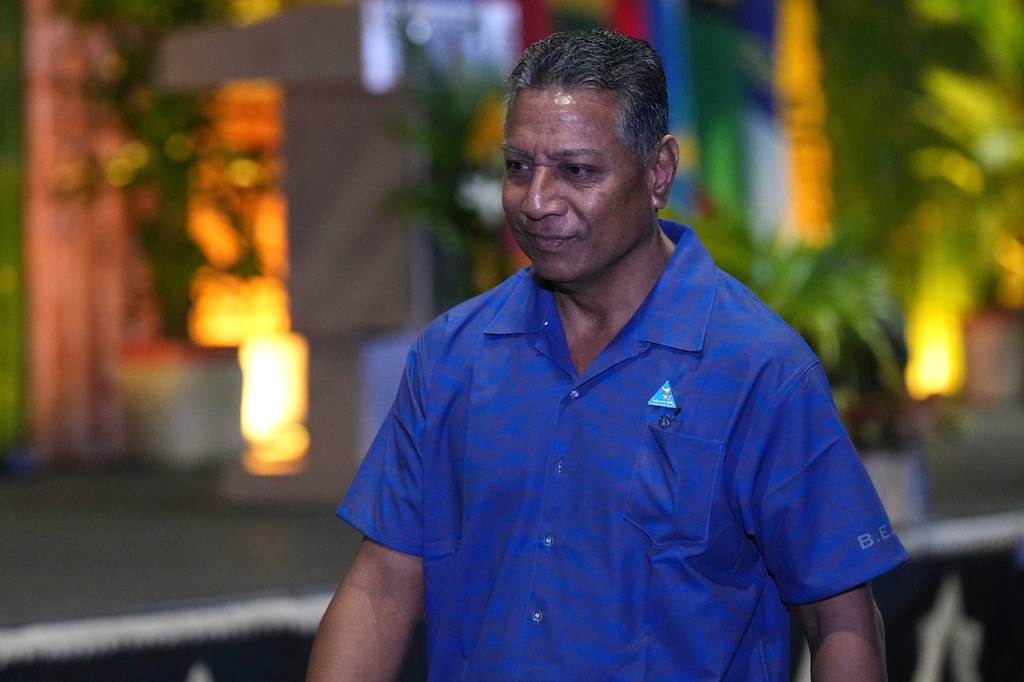 Kiribati's director of foreign service and former ambassador to China, David Teaabo walks to his seat during the opening ceremony at the Pacific Islands Forum Leaders Meeting in Koror, Palau, Monday, Aug. 31, 2026. (AP Photo/Charlotte Graham-McLay)