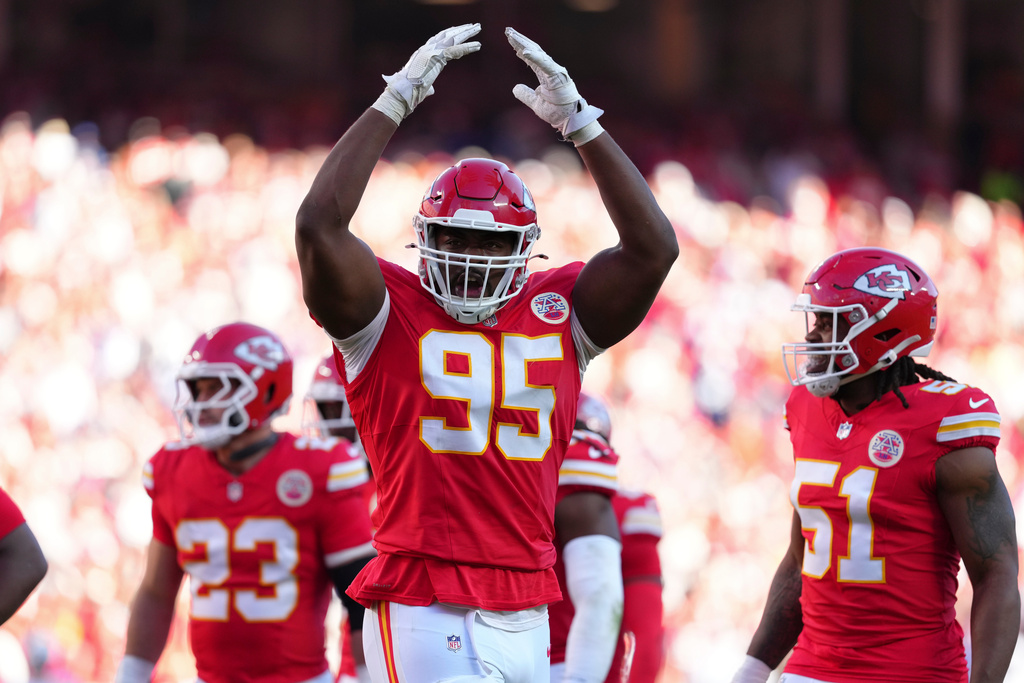 Kansas City Chiefs defensive tackle Chris Jones (95) tires to fire up the crowd during the second half of an NFL football game against the Indianapolis Colts Sunday, Nov. 23, 2025, in Kansas City, Mo. (AP Photo/Ed Zurga)