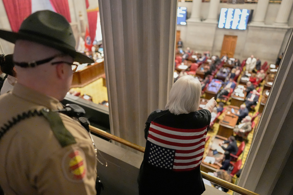 A woman yells down to the House floor as the gallery is cleared by state troopers during a special session of the state legislature to redraw U.S. Congressional voting maps Thursday, May 7, 2026, in Nashville, Tenn. (AP Photo/George Walker IV)