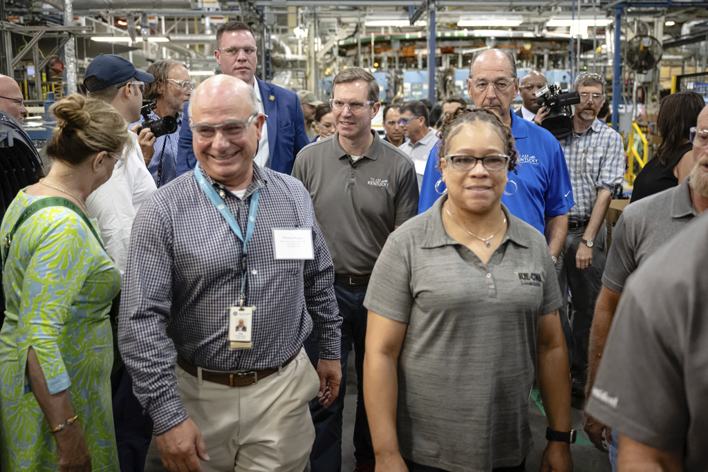 Kentucky Governor Andy Beshear tours an assembly line at GE Appliances global headquarters, Wednesday, Aug 13, 2025, in Louisville, Ky. (AP Photo/Jon Cherry)