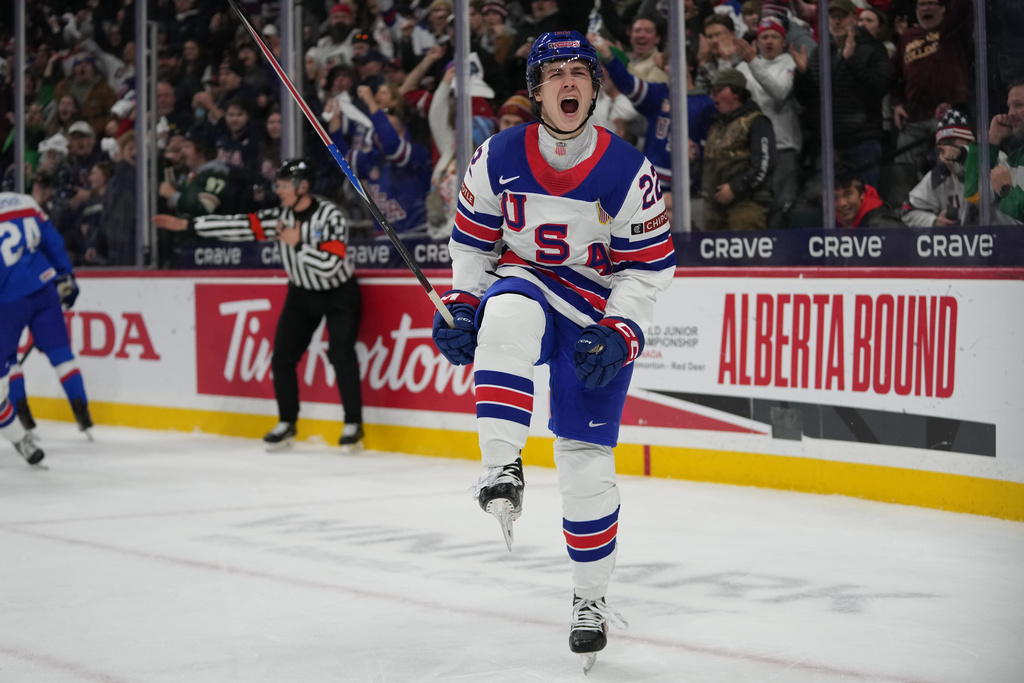 United States forward Brendan McMorrow (22) celebrates after scoring during the second period of an IIHF World Junior Hockey Championship game against Slovakia, Monday, Dec. 29, 2025, in St. Paul, Minn. (AP Photo/Abbie Parr)