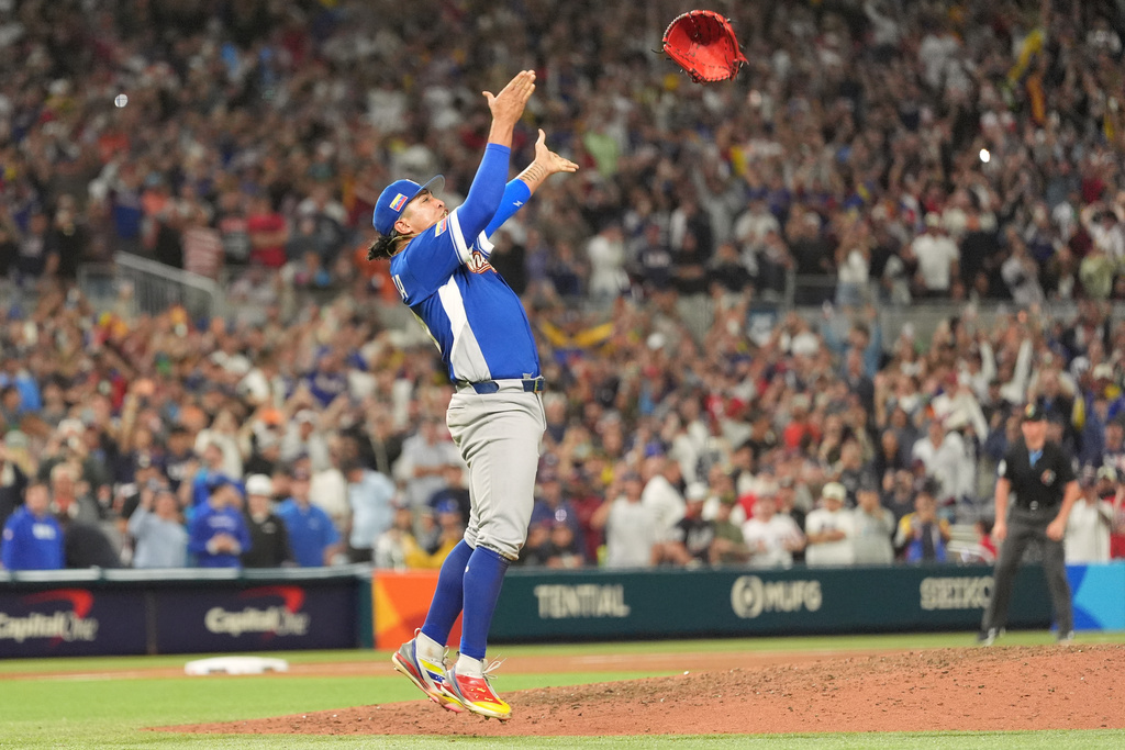 Venezuela pitcher Daniel Palencia celebrates after the team defeated the United States in the championship game of the World Baseball Classic, Tuesday, March 17, 2026, in Miami. (AP Photo/Rebecca Blackwell)
