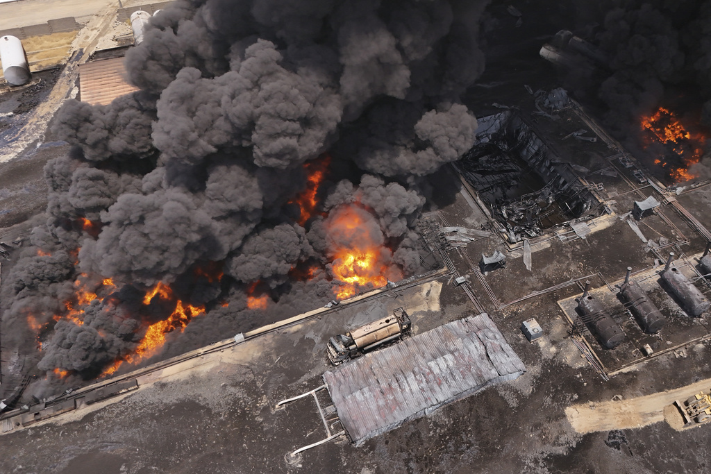 FILE - An oil refinery burns outside Irbil, Iraq, Thursday, June 13, 2024. (AP Photo/Bilind Tahir/Rudaw, File)