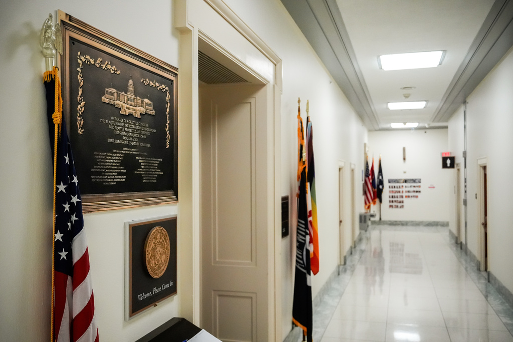 A replica plaque commemorating the Jan. 6, 2021 Capitol riot hangs outside the office of Rep. Jamie Raskin, D-Md., Tuesday, Dec. 30, 2025, at the Rayburn House Office Building on Capitol Hill in Washington. (AP Photo/Julia Demaree Nikhinson)