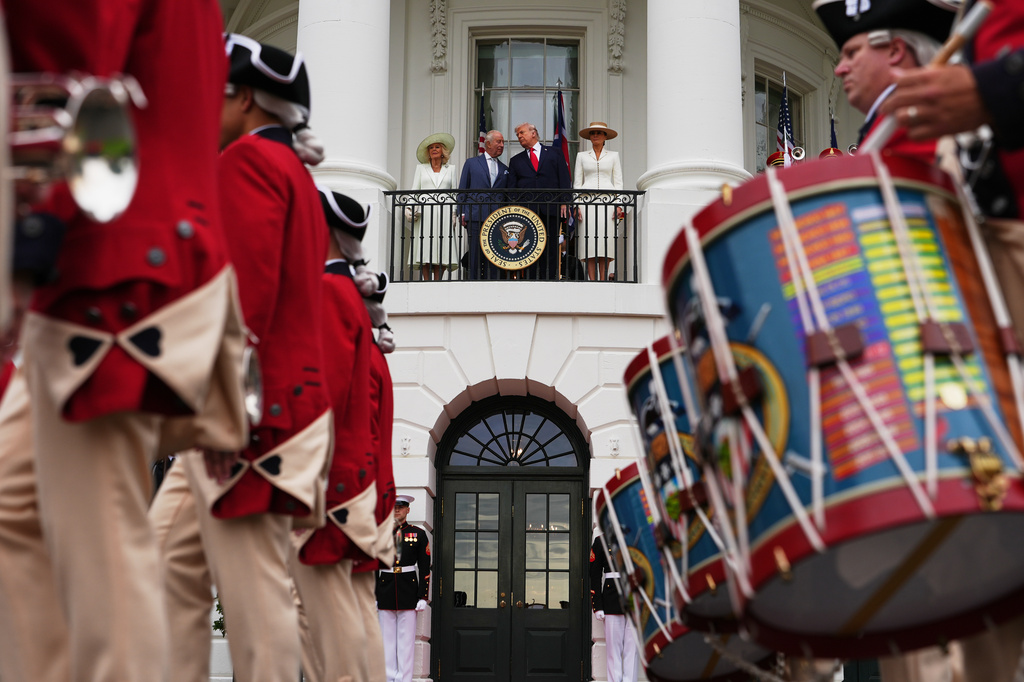 Queen Camilla, King Charles III, President Donald Trump and first lady Melania Trump watch as the United States Army Old Guard Fife and Drum Corps perform during an arrival ceremony on the South Lawn of the White House, Tuesday, April 28, 2026, in Washington. (AP Photo/Julia Demaree Nikhinson)