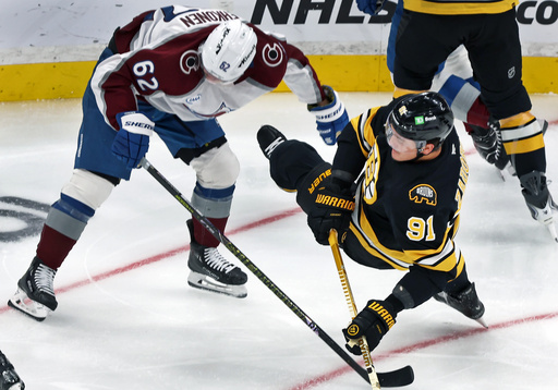 Boston Bruins defenseman Nikita Zadorov, right, hits the ice during a first period collision with Colorado Avalanche forward Artturi Lehkonen during an NHL hockey game, Saturday, Oct. 25, 2025, in Boston. (AP Photo/Jim Davis) Boston Bruins defenseman Nikita Zadorov, right, hits the ice during a first period collision with Colorado Avalanche forward Artturi Lehkonen during an NHL hockey game, Saturday, Oct. 25, 2025, in Boston. (AP Photo/Jim Davis)