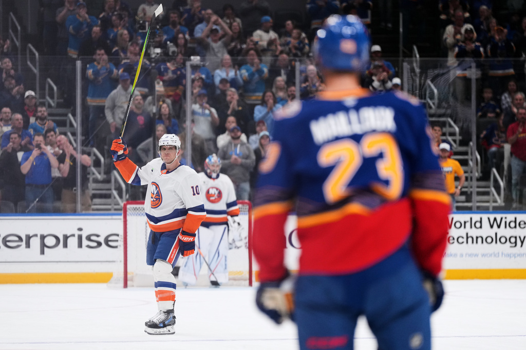 New York Islanders' Brayden Schenn (10) is honored during a time out during the first period of an NHL hockey game against the St. Louis Blues Tuesday, March 10, 2026, in St. Louis. (AP Photo/Jeff Roberson)