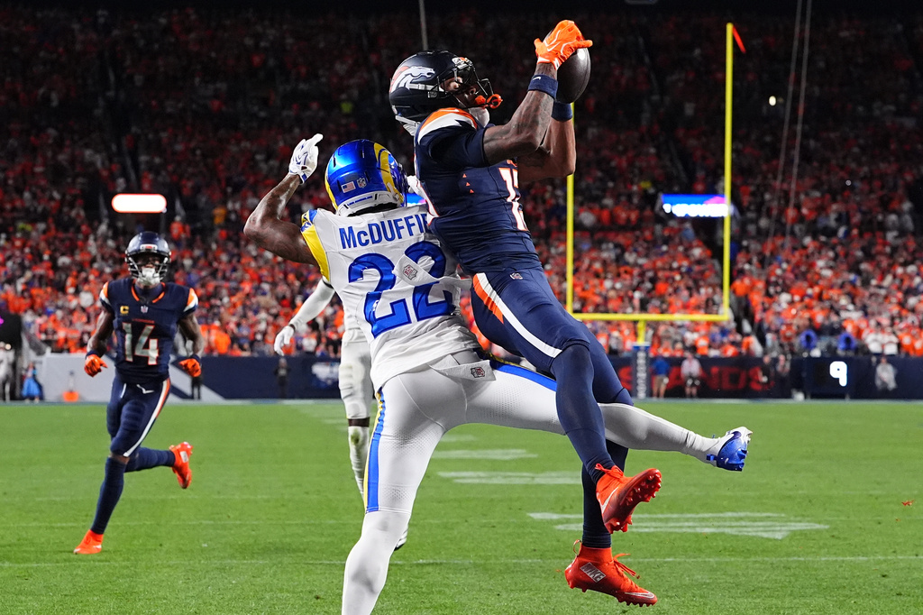 Denver Broncos wide receiver Pat Bryant, right, catches a catch for a 2-point conversion score against Los Angeles Rams cornerback Trent McDuffie (22) during the second half of an NFL football game Sunday, Sept. 27, 2026, in Denver. (AP Photo/David Zalubowski)