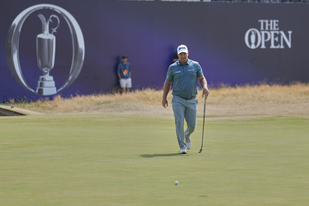 Ryan Fox of New Zealand looks at his putt on the 18th green during the third day of the British Open Golf championships at Royal Birkdale golf club, in Southport, England, Saturday, July 18, 2026. (AP Photo/Jon Super)