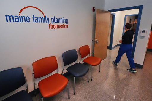 FILE - Vanessa Shields-Haas, a nurse practitioner, walks from the lobby toward the examination rooms at the Maine Family Planning healthcare facility, July 15, 2025, in Thomaston, Maine. (AP Photo/Charles Krupa, file) FILE - Vanessa Shields-Haas, a nurse practitioner, walks from the lobby toward the examination rooms at the Maine Family Planning healthcare facility, July 15, 2025, in Thomaston, Maine. (AP Photo/Charles Krupa, file)
