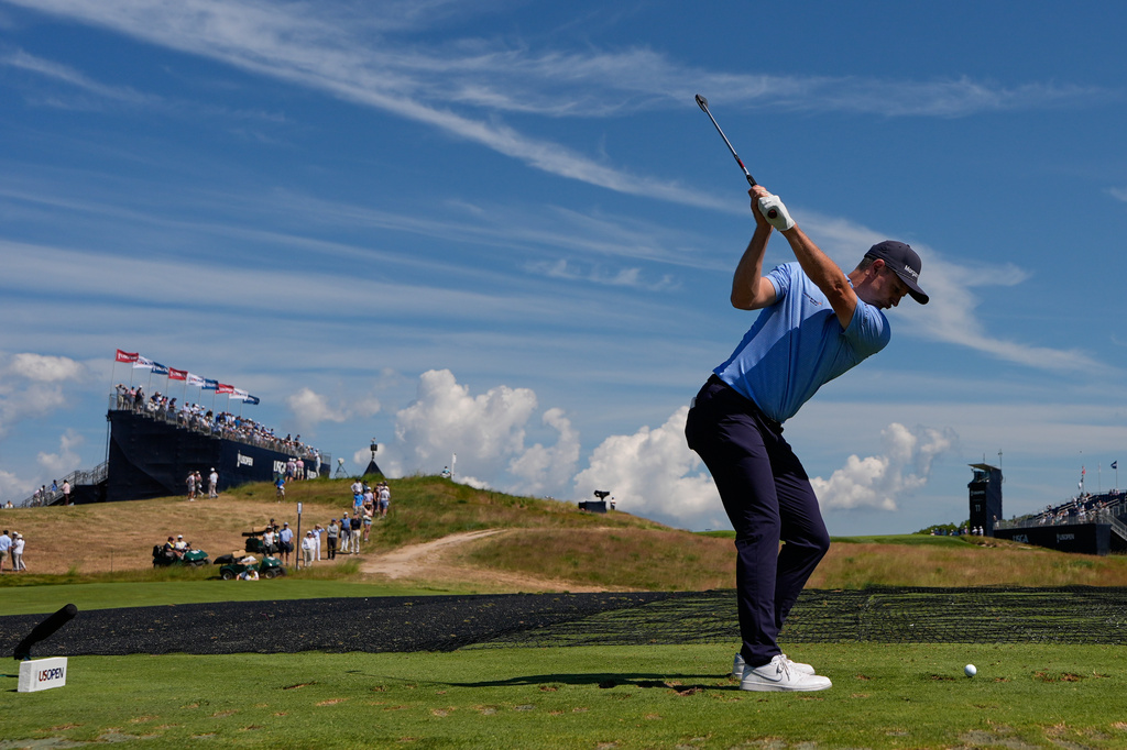 Justin Rose, of England, hits his tee shot on the 11th hole during a practice round for the U.S. Open golf tournament at Shinnecock Hills Golf Club in Southampton, N.Y., Wednesday, June 17, 2026.(AP Photo/David J. Phillip)