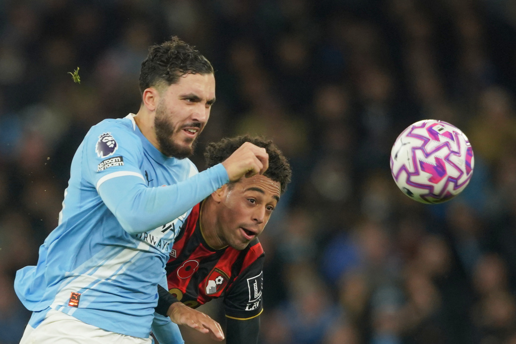 Manchester City's Rayan Cherki, left, challenges for the ball with Bournemouth's Tyler Adams during the English Premier League soccer match between Manchester City and Bournemouth in Manchester, England, Sunday, Nov. 2, 2025. (AP Photo/Ian Hodgson)