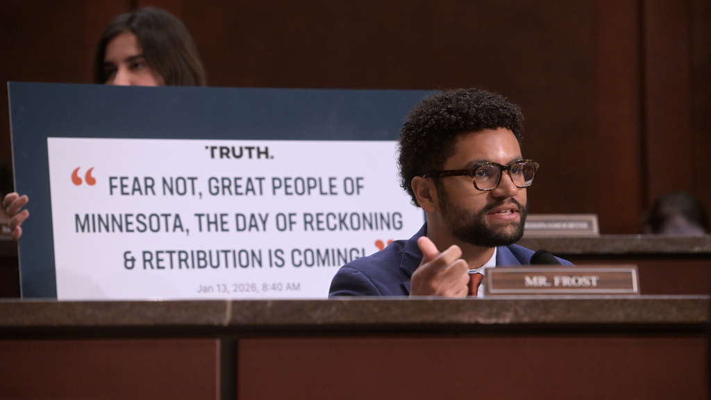 Rep. Maxwell Frost, D-Fla., speaks with Gov. Tim Walz, D-Minn., speaks during a House Committee on Oversight and Government Reform hearing on oversight of fraud and misuse of Federal funds in Minnesota, Wed., March 4, 2026, on Capitol Hill in Washington. (AP Photo/Rod Lamkey, Jr.)