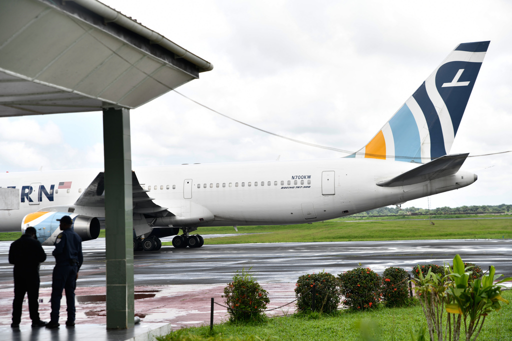A plane carrying the deportees from the US arrives at the Roberts International Airport outside of Monrovia, Liberia, Thursday, Aug. 20, 2026. (AP Photo/Alexander Wiaplah)