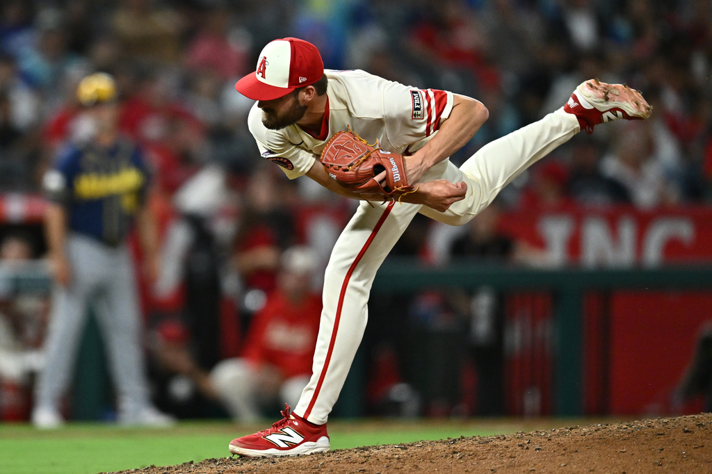 Los Angeles Angels pitcher Luke Murphy delivers in his major league debut during the eighth inning of a baseball game against the Milwaukee Brewers, Friday, July 31, 2026, in Anaheim, Calif. (AP Photo/William Liang)
