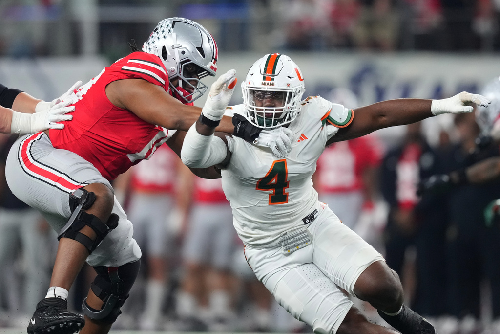 Ohio State offensive lineman Phillip Daniels, left, blocks Miami defensive lineman Rueben Bain Jr. during the first half of the Cotton Bowl College Football Playoff quarterfinal game Wednesday, Dec. 31, 2025, in Arlington, Texas. (AP Photo/Julio Cortez)