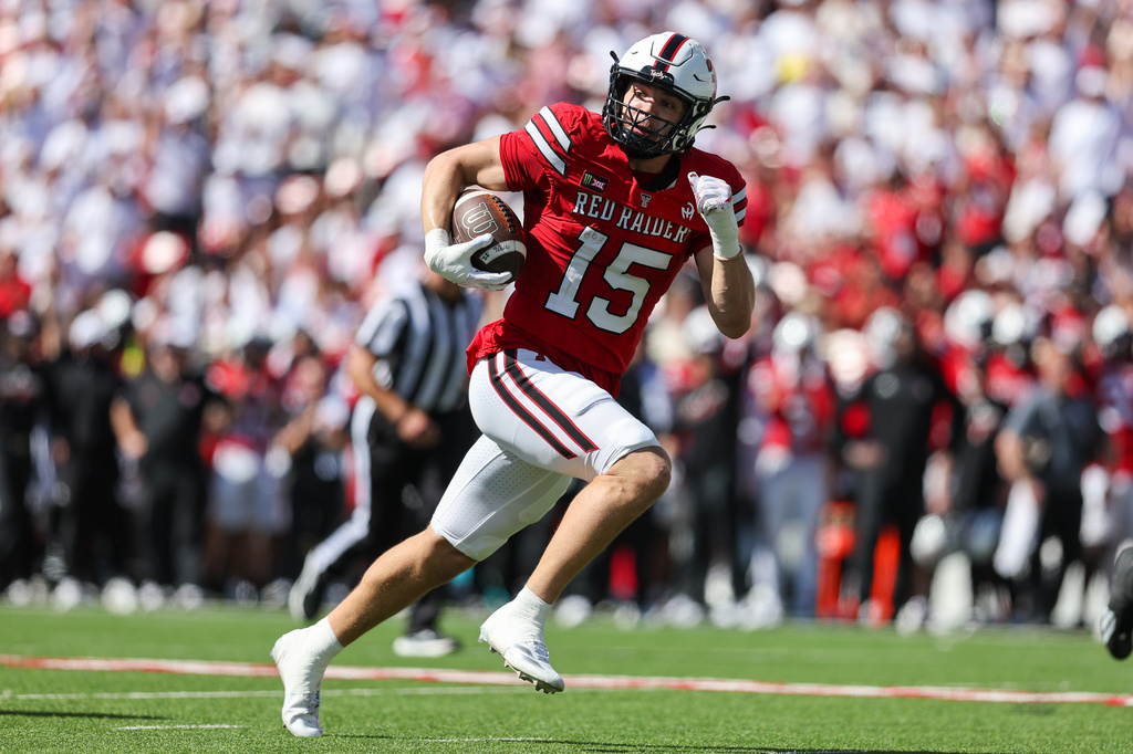 Texas Tech linebacker Austin Romaine (15) returns an interception for a touchdown during the first half of an NCAA college football game against Sam Houston State, Saturday, Sept. 26, 2026, in Lubbock, Texas. (AP Photo/Chase Seabolt)