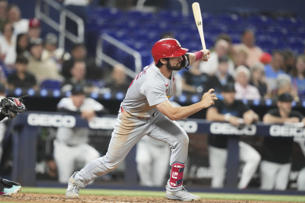 St. Louis Cardinals' Thomas Saggese follows through on a single during the third inning of a baseball game against the Miami Marlins, Tuesday, Aug. 19, 2025, in Miami. (AP Photo/Lynne Sladky)