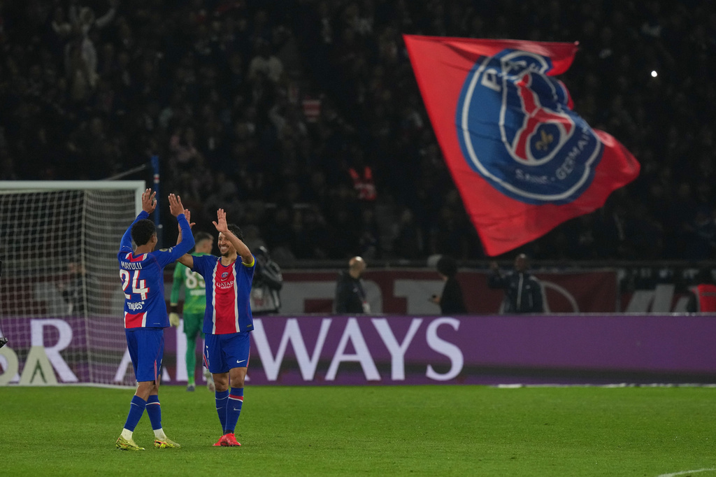 PSG's Senny Mayulu, left, and Marquinhos celebrate after the French League One soccer match between Paris Saint Germain and Brest in Paris, France, Sunday, May 10, 2026. (AP Photo/Thibault Camus)