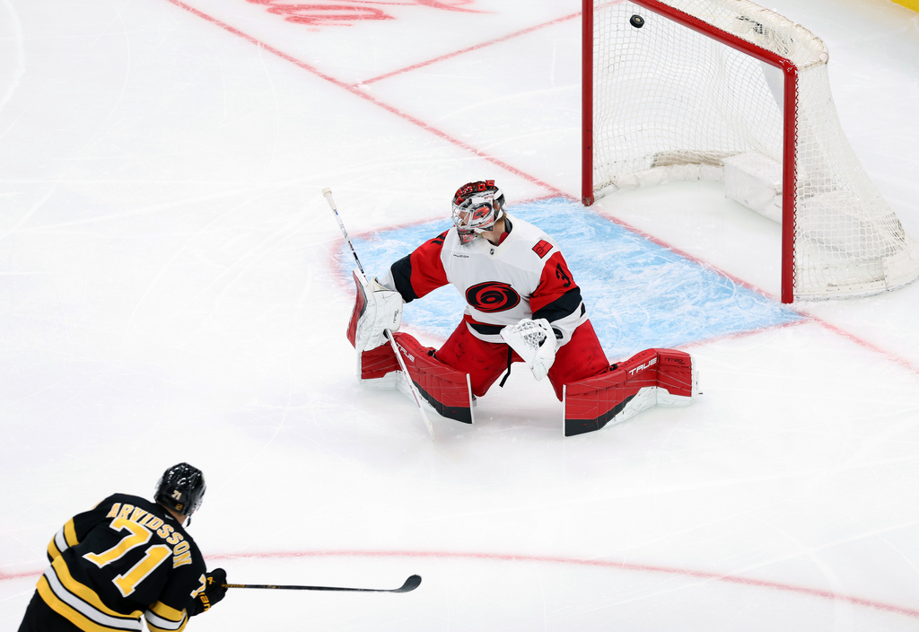 Boston Bruins' forward Viktor Arvidsson scores past Carolina Hurricanes goalie Frederik Andersen during the third period goal of an NHL hockey game, Saturday, Nov. 1, 2025, in Boston. (AP Photo/Jim Davis)