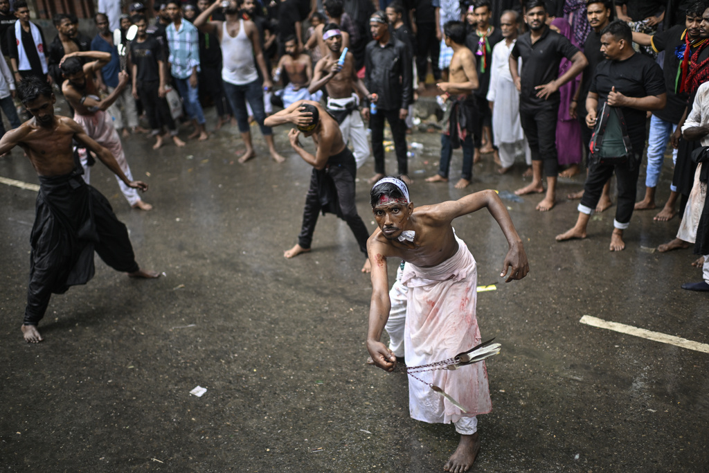 Bangladeshi Shiite Muslims participate in an Ashoura commemoration marking the 7th-century death of Imam Hussein, the grandson of the Prophet Muhammad, in Dhaka, Bangladesh, Sunday, July 6, 2025. (AP Photo/Mahmud Hossain Opu)
