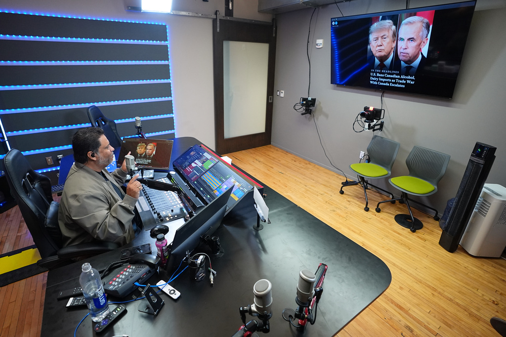 Victor Martinez, who runs La Mega 101.7, a Spanish-language radio station in Pennsylvania's Lehigh Valley, hosts a politics talk show from his studio in Allentown, Pa., on Sept. 29, 2026. (AP Photo/Matt Rourke)