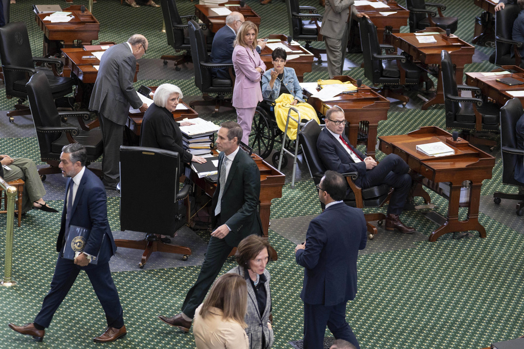 Senate Republicans react as some Senate Democrats walk off the Senate floor as the redistricting bill is brought up at the Texas Capitol in Austin, Tuesday, Aug. 12, 2025. (Mikala Compton/Austin American-Statesman via AP)