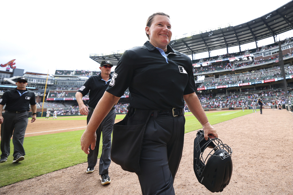 Home plate umpire Jen Pawol walks off the field after completing her first baseball game, between the Miami Marlins and the Atlanta Braves, Sunday, Aug. 10, 2025, in Atlanta. (AP Photo/Colin Hubbard)