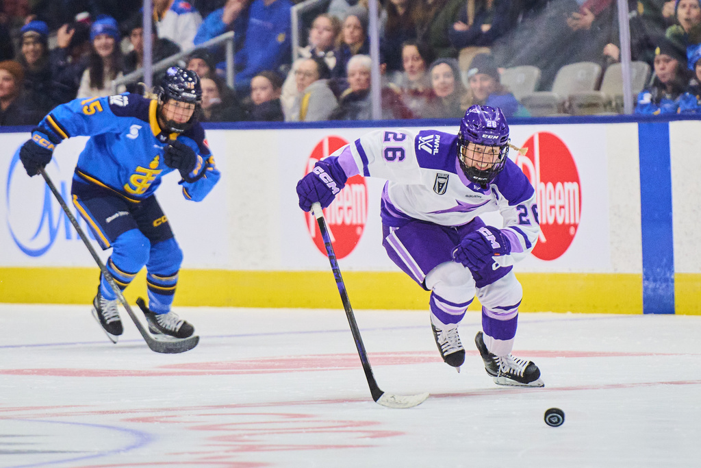 Minnesota Frost's Kendall Coyne Schofield (26) sprints past Toronto Sceptres' Savannah Harmon (15) to score a breakaway empty net goal during third period PWHL hockey action in Toronto, Tuesday, Dec. 30, 2025. (Sammy Kogan/The Canadian Press via AP)