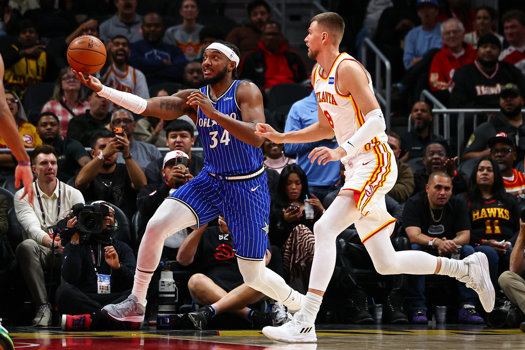 Orlando Magic center Wendell Carter Jr. (34) shoots the ball during the first half of an NBA basketball game against the Atlanta Hawks, Tuesday, Nov. 4, 2025, in Atlanta. (AP Photo/Colin Hubbard)
