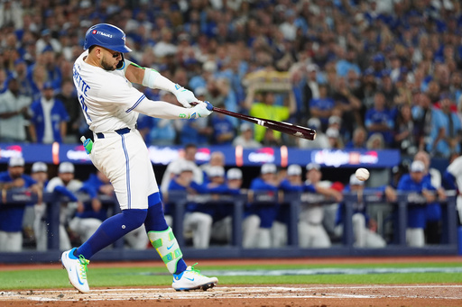 Toronto Blue Jays' Bo Bichette hits a single against the Los Angeles Dodgers during the first inning of Game 1 of baseball's World Series, Friday, Oct. 24, 2025, in Toronto. (Frank Gunn/The Canadian Press via AP) Toronto Blue Jays' Bo Bichette hits a single against the Los Angeles Dodgers during the first inning of Game 1 of baseball's World Series, Friday, Oct. 24, 2025, in Toronto. (Frank Gunn/The Canadian Press via AP)