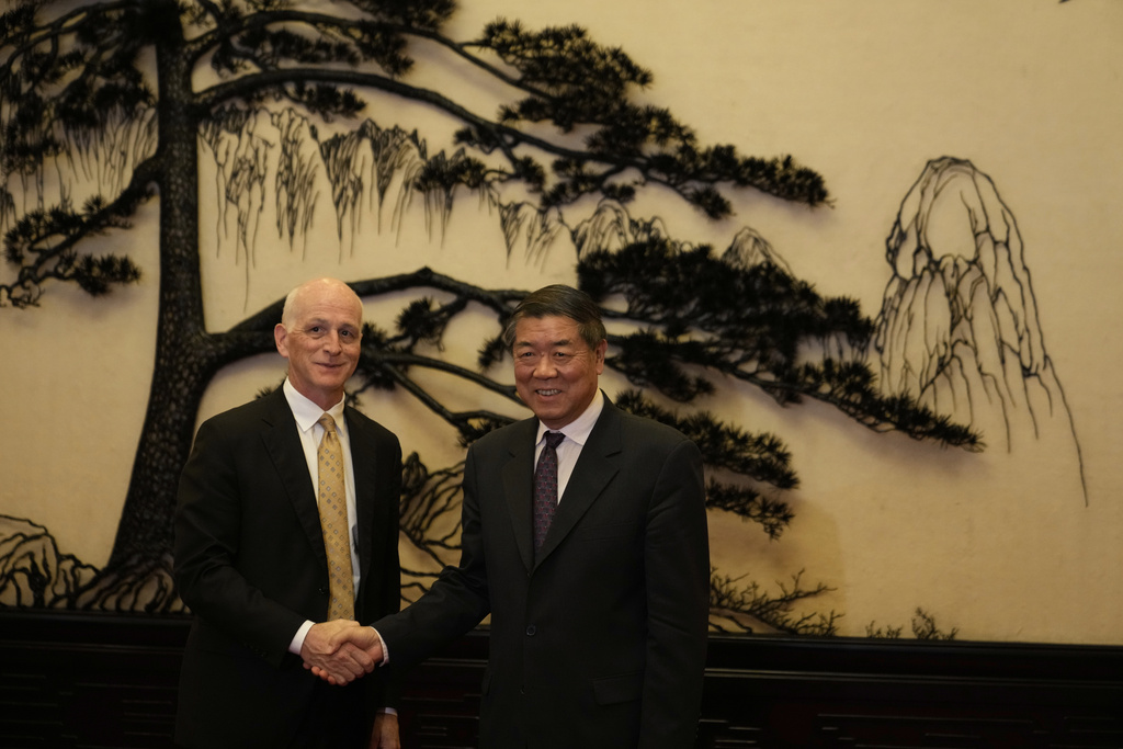 Rep. Adam Smith, D-Wash, left, shakes hands with Chinese Vice Premier He Lifeng as he leads a bipartisan group of U.S. lawmakers for a meeting at the Great Hall of the People in Beijing, China, Monday, Sept. 22, 2025. (AP Photo/Mahesh Kumar A., Pool)