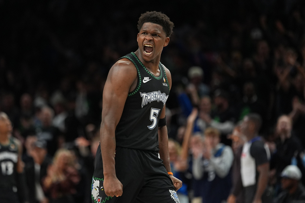 Minnesota Timberwolves guard Anthony Edwards (5) reacts after scoring against the San Antonio Spurs during the second half of Game 4 of an NBA basketball second-round playoffs series in Minneapolis, Sunday, May 10, 2026. (AP Photo/Abbie Parr)