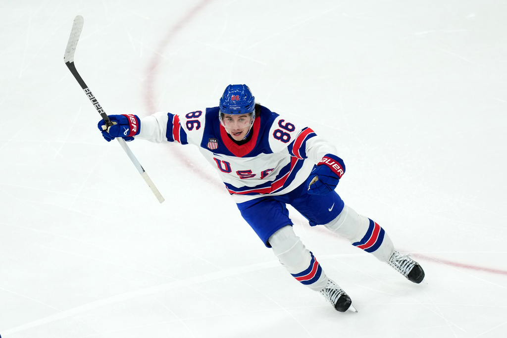 United States' Jack Hughes celebrates after scoring the winning goal against Canada during the overtime period of the men's ice hockey gold medal game at the 2026 Winter Olympics in Milan, Italy, Sunday, Feb. 22, 2026. (AP Photo/Carolyn Kaster)