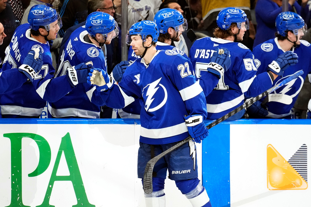 Tampa Bay Lightning right wing Oliver Bjorkstrand (22) celebrates with the bench after scoring against the Los Angeles Kings during the first period of an NHL hockey game Thursday, Dec. 18, 2025, in Tampa, Fla. (AP Photo/Chris O'Meara)