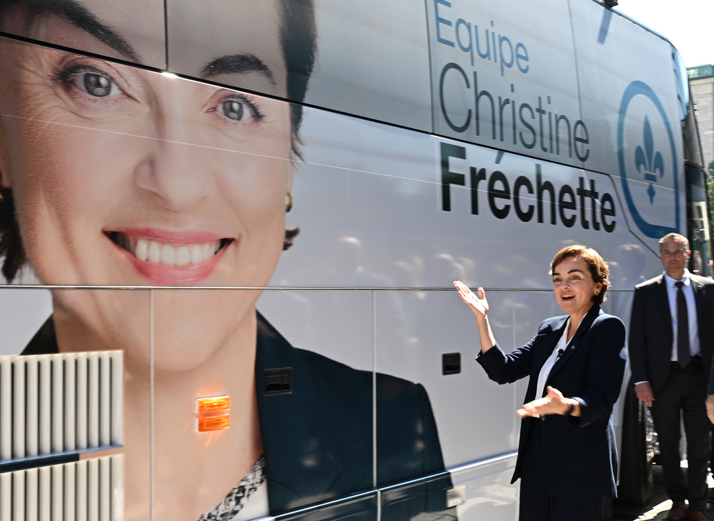 Coalition Avenir Quebec Leader Christine Frechette poses as she walks by her campaign bus after calling a general election in Quebec City, on Thursday, Aug. 27, 2026. (Jacques Boissinot/The Canadian Press via AP)
