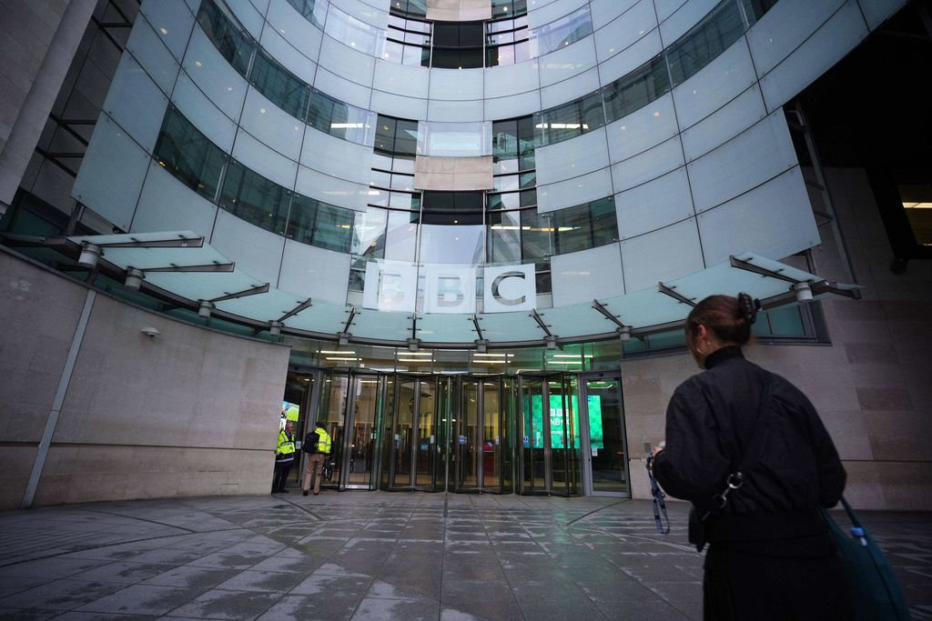 Staff arrive at BBC Broadcasting House in London, Monday Nov. 10, 2025. (James Manning/PA via AP)