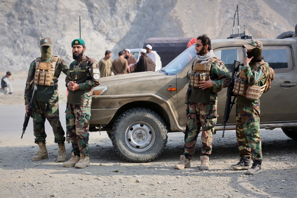 Afghan Taliban soldiers gather on the Afghan side of the Torkham border crossing with Pakistan in Torkham, Afghanistan, Friday, Feb. 27, 2026. (AP Photo/Wahidullah Kakar)