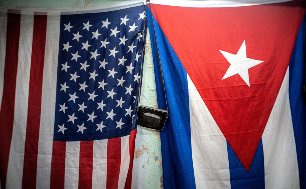 FILE - A U.S. and Cuban flag hangs on a wall in Havana, Cuba, Monday, Jan 11, 2021. (AP Photo/Ramon Espinosa, File)