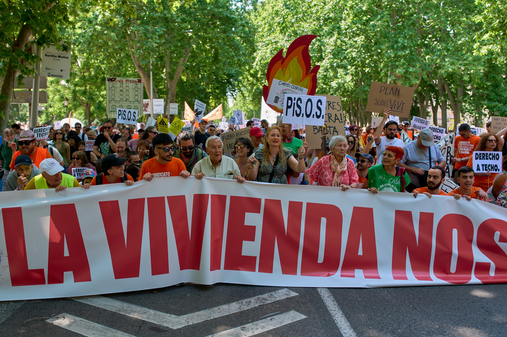 People take part during a protest in Madrid, Spain, Sunday, May 24, 2026, against rising housing costs that are pricing many Spaniards out of the market amid a broader housing crisis in Spain. (AP Photo/Manu Fernandez)
