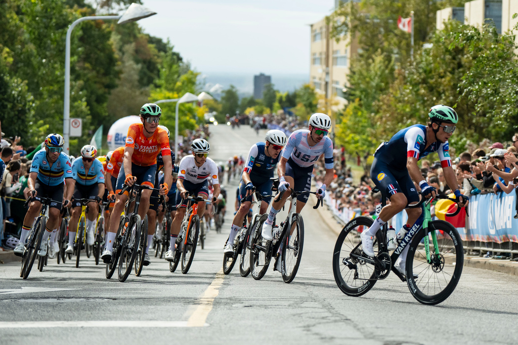 Brandon McNulty, of the United States, second right, races in the peloton during the men's elite road race at the UCI Road World Championships cycling event in Montreal, on Sunday, Sept. 27, 2026. (Christopher Katsarov/The Canadian Press via AP)