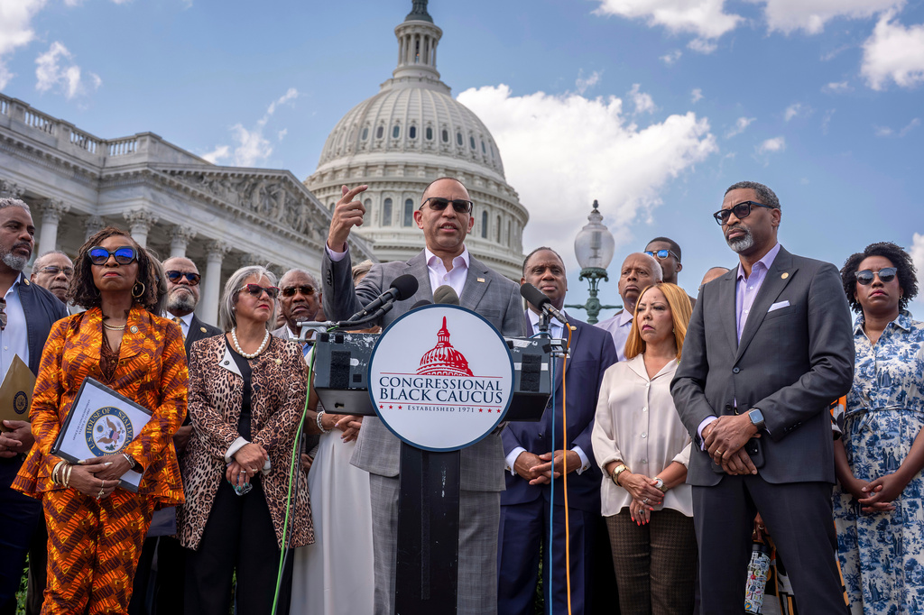 FILE - House Minority Leader Hakeem Jeffries, D-N.Y., center, and members of the Congressional Black Caucus speak outside the Capitol in Washington, May 19, 2026. (AP Photo/J. Scott Applewhite, File)