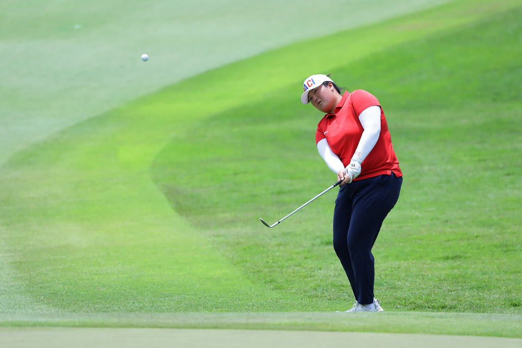 Angel Yin of the United States plays her shot during the HSBC Women's World Championship at Sentosa Golf Club in Singapore, Sunday, March 1, 2026. (AP Photo/Suhaimi Abdullah)
